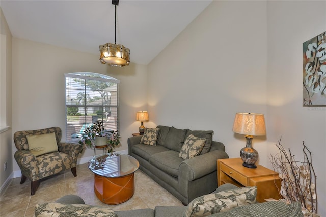 living room with baseboards and high vaulted ceiling