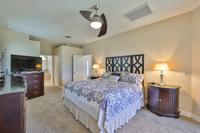 bedroom with visible vents, baseboards, and light colored carpet