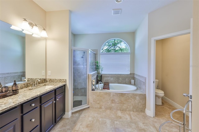 full bathroom featuring vanity, toilet, a shower stall, visible vents, and a garden tub