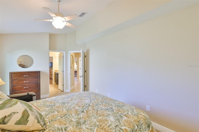 bedroom featuring baseboards, visible vents, light carpet, and vaulted ceiling