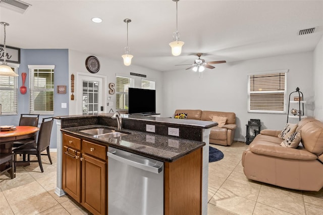 kitchen featuring visible vents, open floor plan, a sink, and dishwasher
