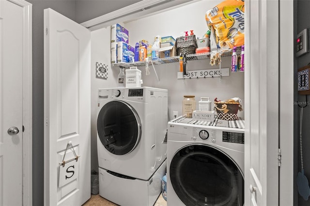 laundry area featuring washing machine and clothes dryer and laundry area