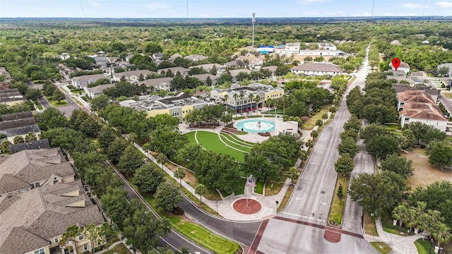 aerial view with a wooded view and a residential view