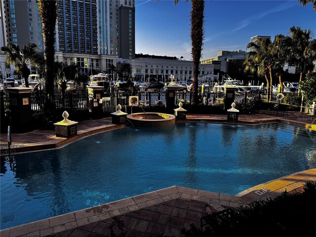 700 S Harbour Island Blvd Unit 342, Tampa, FL 33602 - view of swimming pool featuring fence, a pool with connected hot tub, and a view of city