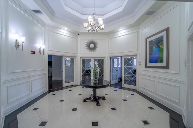 700 S Harbour Island Blvd Unit 342, Tampa, FL 33602 - entryway with a decorative wall, french doors, a chandelier, tile patterned floors, and a high ceiling