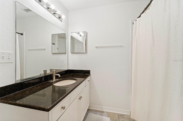 700 S Harbour Island Blvd Unit 342, Tampa, FL 33602 - full bathroom with tile patterned floors, vanity, curtained shower, and baseboards