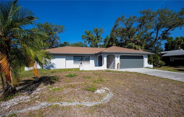 2167 Corfell St, Port Charlotte, FL 33948 - ranch-style house featuring an attached garage, driveway, and stucco siding