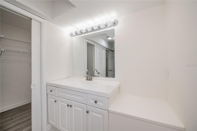 2167 Corfell St, Port Charlotte, FL 33948 - bathroom featuring wood finished floors, vanity, and baseboards