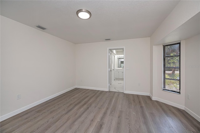 2167 Corfell St, Port Charlotte, FL 33948 - empty room with wood finished floors and baseboards