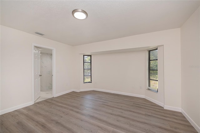 2167 Corfell St, Port Charlotte, FL 33948 - empty room with wood finished floors and baseboards