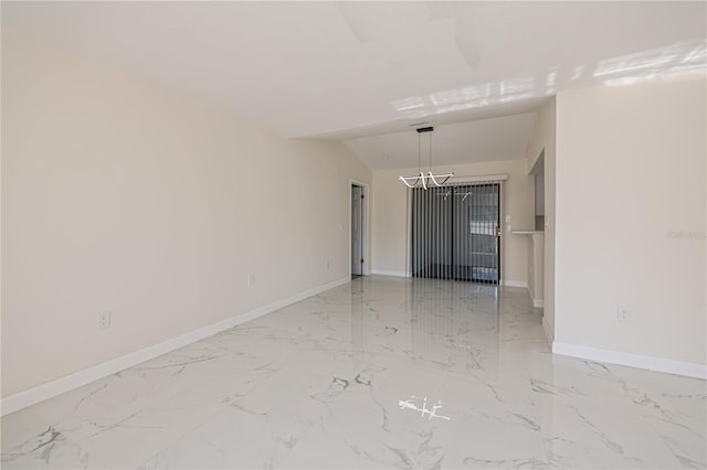 2167 Corfell St, Port Charlotte, FL 33948 - spare room featuring light marble finish floors, baseboards, a chandelier, and vaulted ceiling