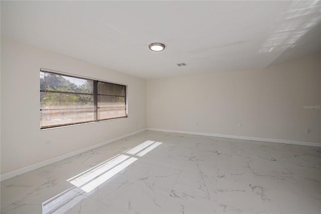 2167 Corfell St, Port Charlotte, FL 33948 - empty room featuring light marble finish floors and baseboards