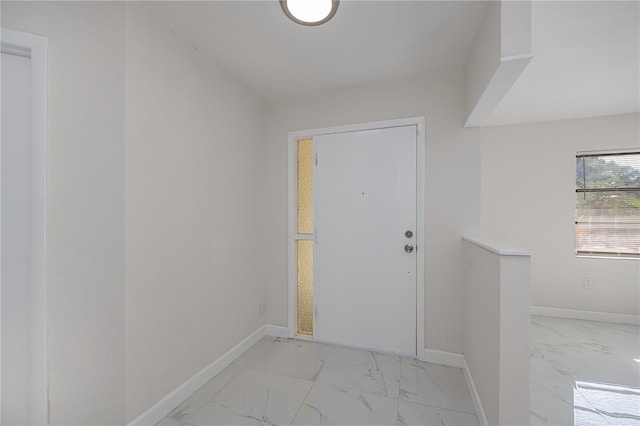 2167 Corfell St, Port Charlotte, FL 33948 - doorway with light marble finish floors and baseboards