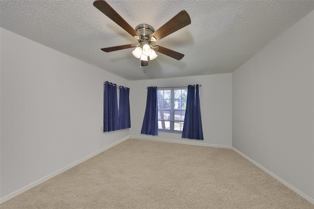 330 Promenade Dr Unit 206, Dunedin, FL 34698 - spare room featuring a textured ceiling, light carpet, and baseboards