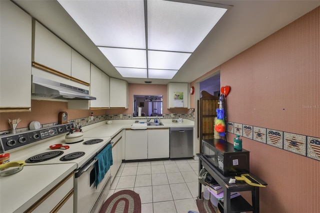 330 Promenade Dr Unit 206, Dunedin, FL 34698 - kitchen featuring light countertops, white electric range oven, under cabinet range hood, and dishwasher