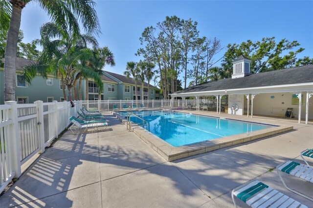 330 Promenade Dr Unit 206, Dunedin, FL 34698 - pool featuring a patio and fence
