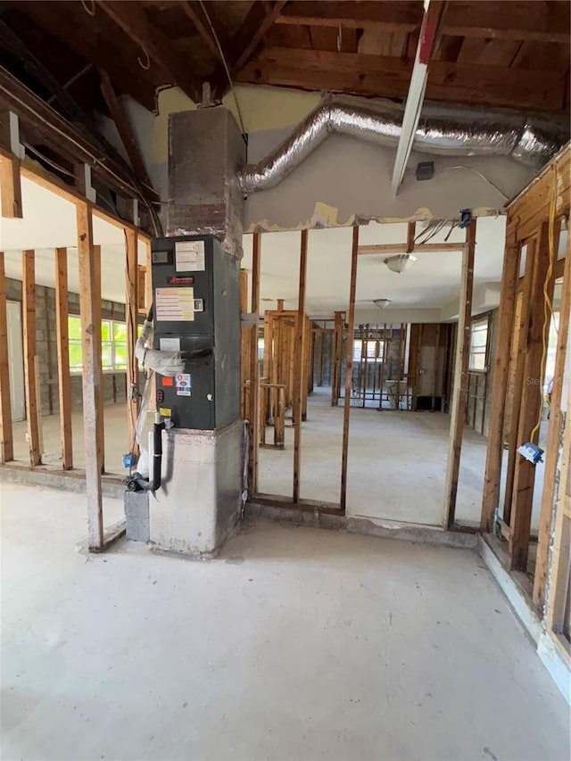 4218 Carson St NE, Saint Petersburg, FL 33703 - misc room featuring heating unit and unfinished concrete flooring