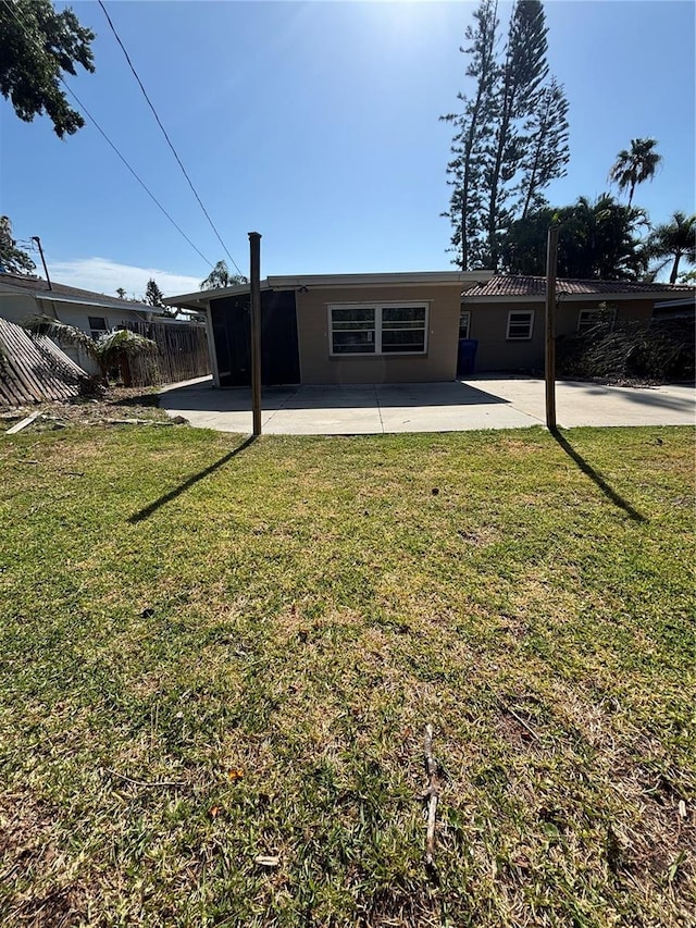 4218 Carson St NE, Saint Petersburg, FL 33703 - view of front of home featuring a front yard, fence, and a patio area