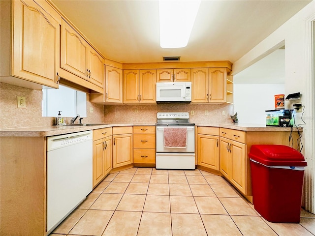 kitchen with light brown cabinets, white appliances, light countertops, decorative backsplash, and visible vents