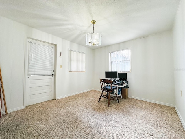 office with carpet flooring, baseboards, and a chandelier