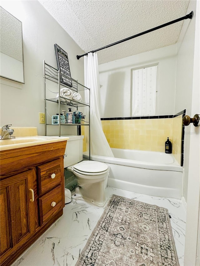 full bathroom featuring a textured ceiling, shower / bath combination with curtain, vanity, toilet, and marble finish floor