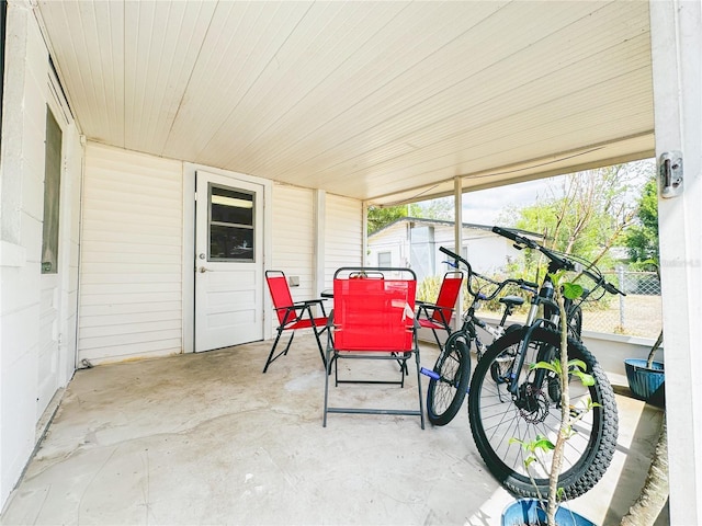 sunroom / solarium with outdoor dining space