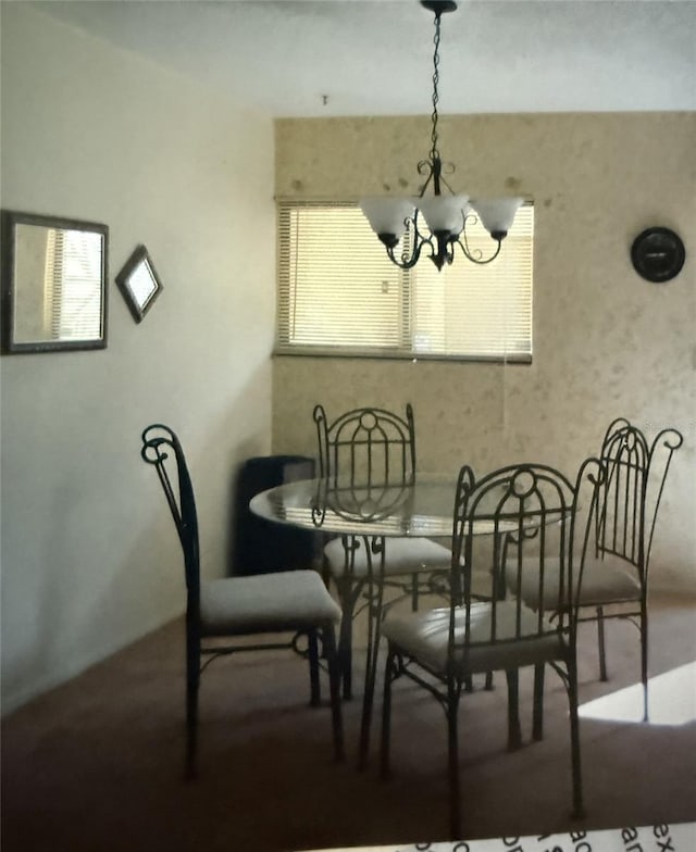 dining room featuring a chandelier
