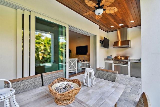 view of patio featuring area for grilling, a ceiling fan, and grilling area