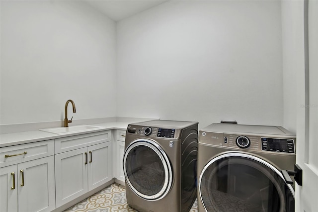 washroom featuring washing machine and dryer and cabinet space