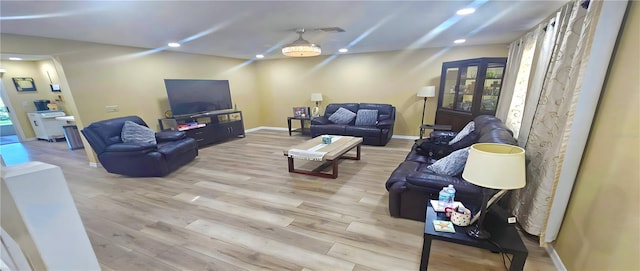 3086 Pointer Dr, Palm Harbor, FL 34683 - living room with recessed lighting, light wood-style floors, and baseboards