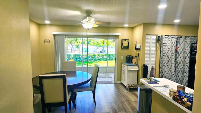 3086 Pointer Dr, Palm Harbor, FL 34683 - dining area featuring a ceiling fan, wood finished floors, recessed lighting, and a textured ceiling