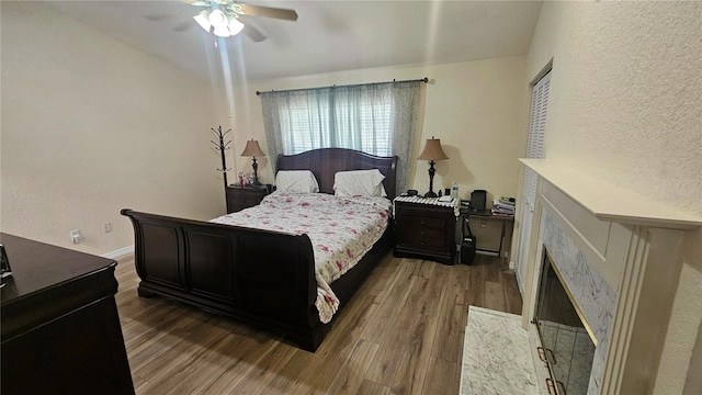 3086 Pointer Dr, Palm Harbor, FL 34683 - bedroom featuring wood finished floors, a textured wall, and ceiling fan