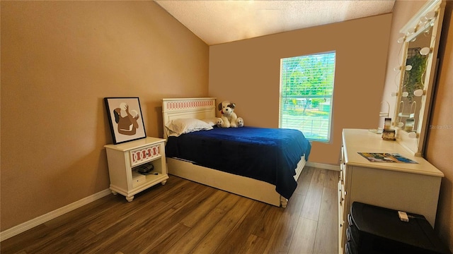 3086 Pointer Dr, Palm Harbor, FL 34683 - bedroom with wood finished floors, vaulted ceiling, and baseboards