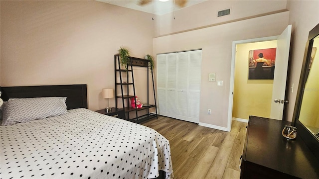 3086 Pointer Dr, Palm Harbor, FL 34683 - bedroom with wood finished floors, baseboards, and a closet