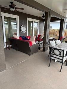 1747 Wood Brook St, Tarpon Springs, FL 34689 - view of patio with a ceiling fan and outdoor dining space