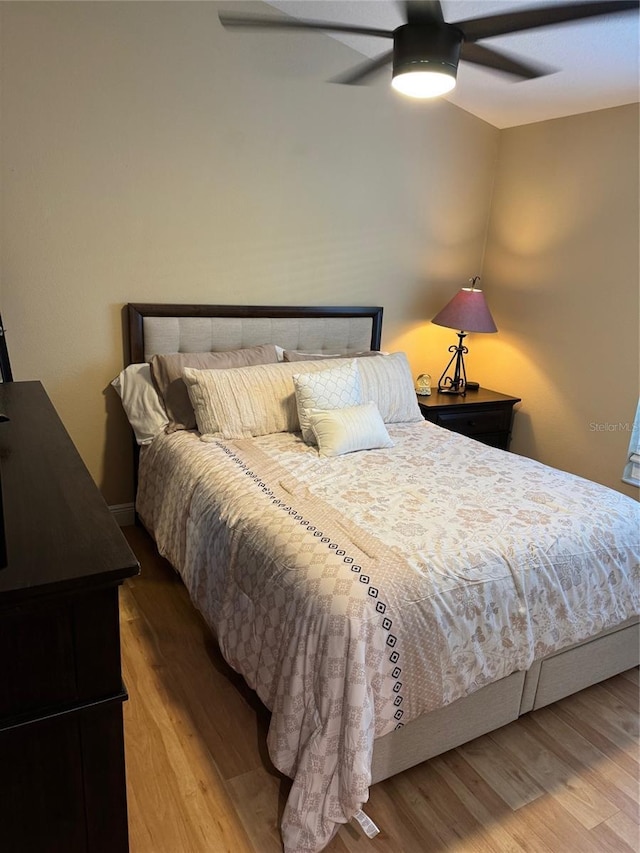 1747 Wood Brook St, Tarpon Springs, FL 34689 - bedroom with wood finished floors and ceiling fan