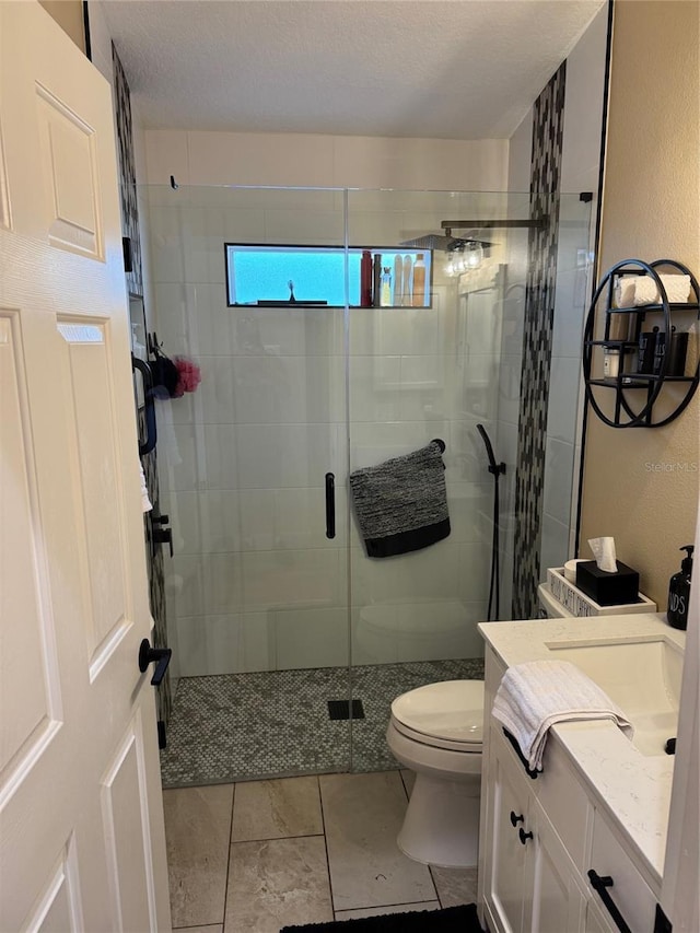 1747 Wood Brook St, Tarpon Springs, FL 34689 - full bathroom with vanity, toilet, a shower stall, and tile patterned floors