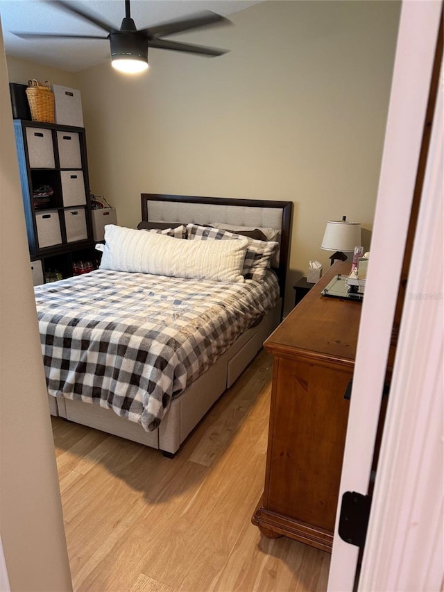 1747 Wood Brook St, Tarpon Springs, FL 34689 - bedroom with light wood-type flooring and ceiling fan