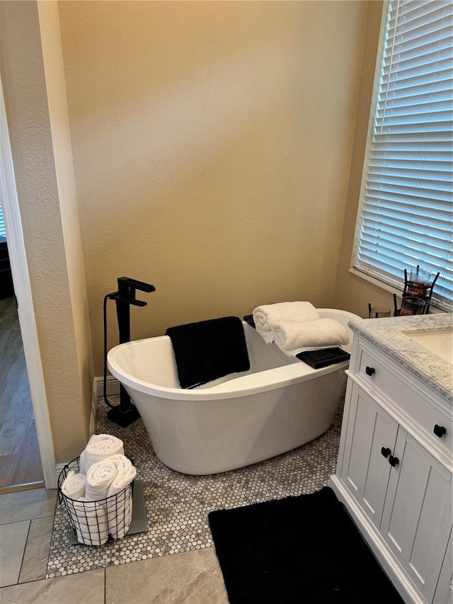 1747 Wood Brook St, Tarpon Springs, FL 34689 - bathroom featuring a freestanding tub and vanity