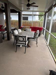 1747 Wood Brook St, Tarpon Springs, FL 34689 - sunroom with a ceiling fan and outdoor dining area