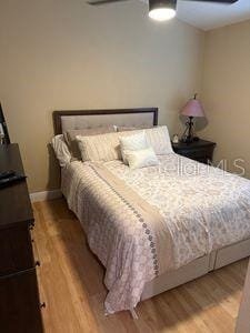 1747 Wood Brook St, Tarpon Springs, FL 34689 - bedroom featuring light wood-type flooring, ceiling fan, and baseboards