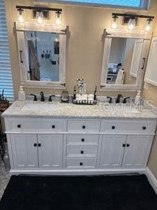 1747 Wood Brook St, Tarpon Springs, FL 34689 - bathroom with double vanity and a shower