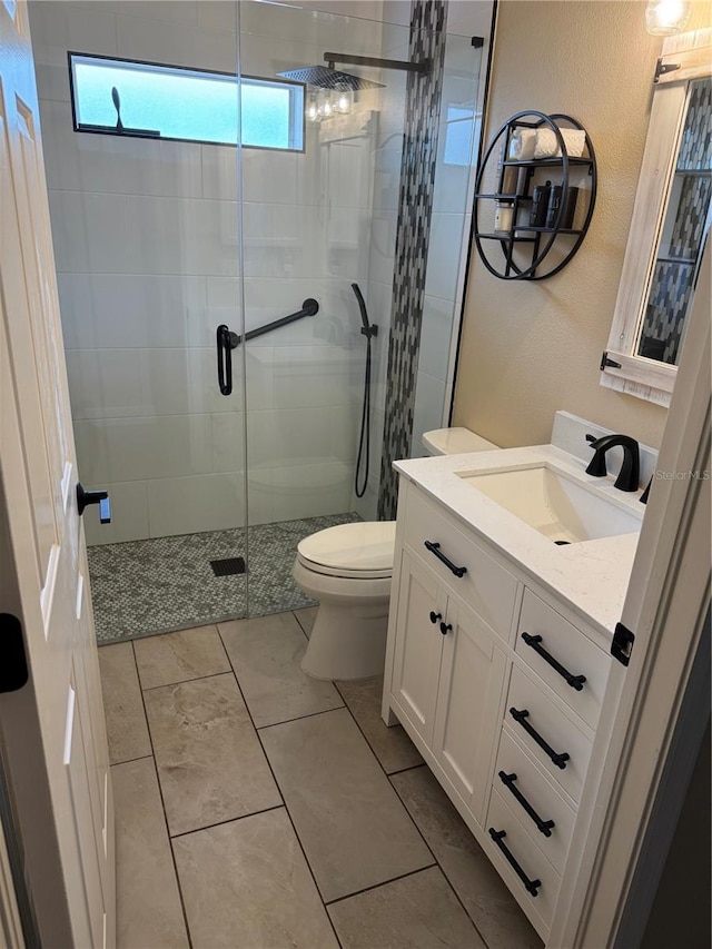 1747 Wood Brook St, Tarpon Springs, FL 34689 - full bath featuring toilet, vanity, a shower stall, and a textured wall