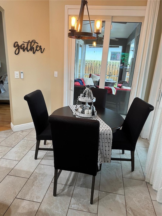 1747 Wood Brook St, Tarpon Springs, FL 34689 - dining space featuring a chandelier and baseboards