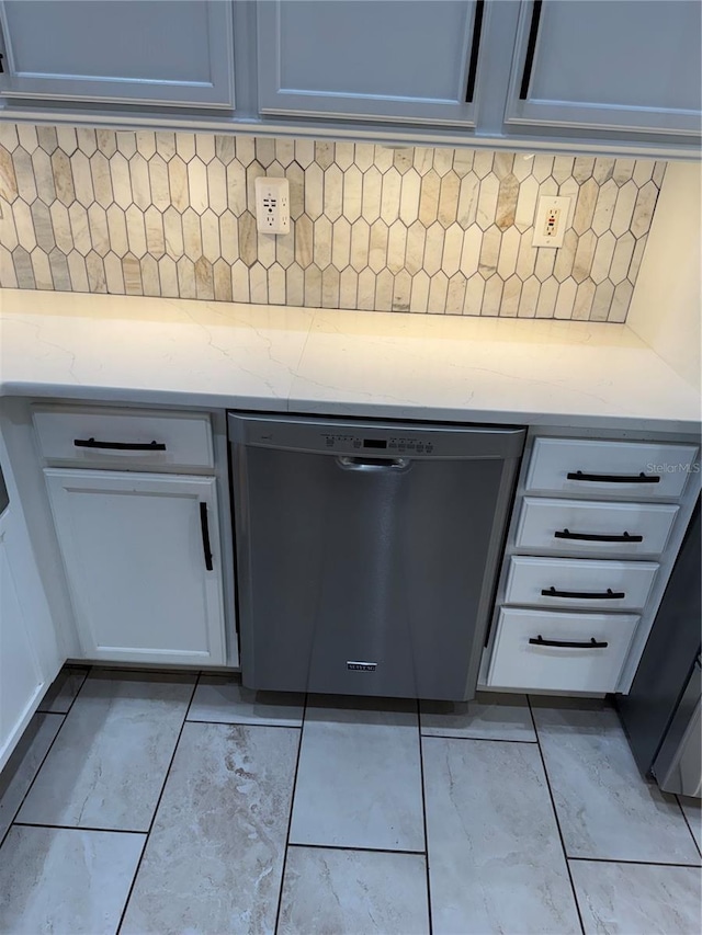 1747 Wood Brook St, Tarpon Springs, FL 34689 - kitchen view of dishwasher, light stone countertops, and decorative backsplash