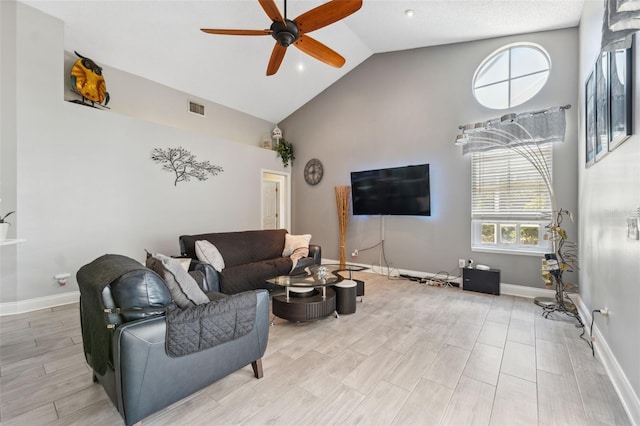living room with high vaulted ceiling, baseboards, a ceiling fan, and visible vents