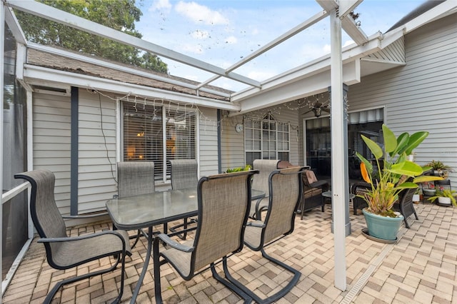 view of patio with ceiling fan and outdoor dining area