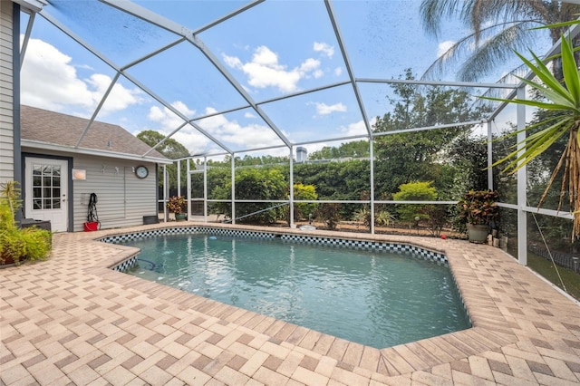 outdoor pool featuring a lanai and a patio