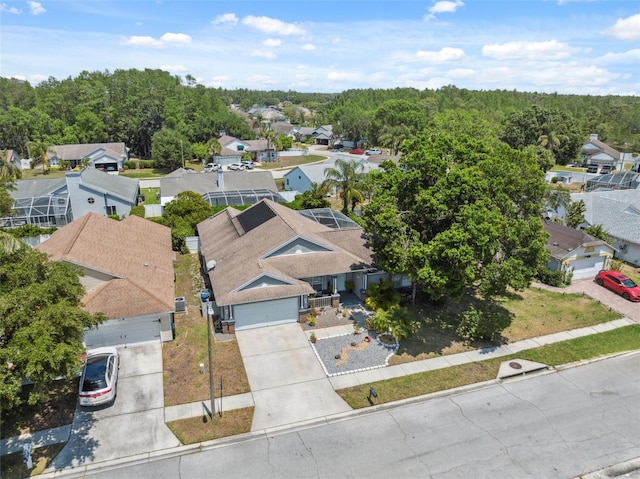 aerial view featuring a residential view and a view of trees