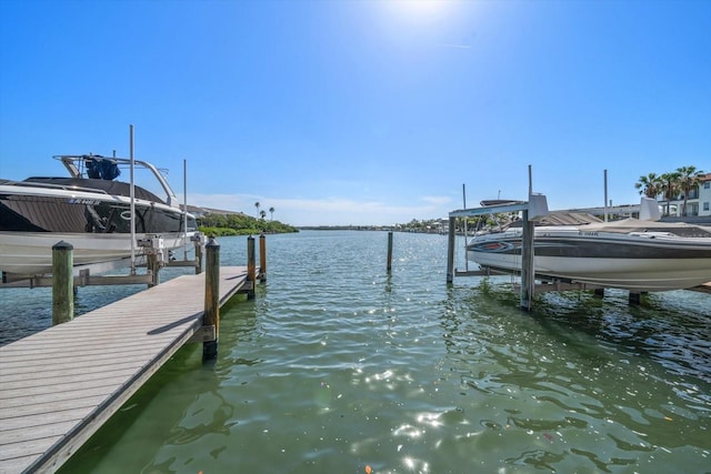 829 E Gulf Blvd Unit 107, Indian Rocks Beach, FL 33785 - dock featuring boat lift and a water view